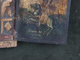 painting of a man on a horse and a book on a table
