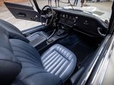 a view of the interior of a car from the driver ' s seat