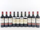 a group of six bottles of wine sitting next to each other