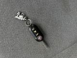 an image of a car key on the seat of a car