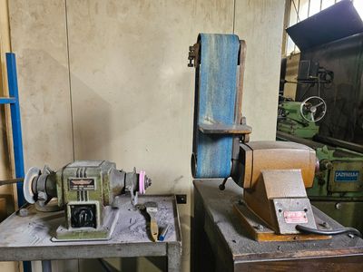 two machines that are sitting on a table in a room