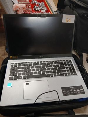 a laptop that is sitting in a suitcase on the floor