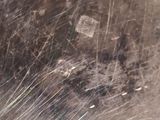 a close up of a metal pan with a lot of dirt on it