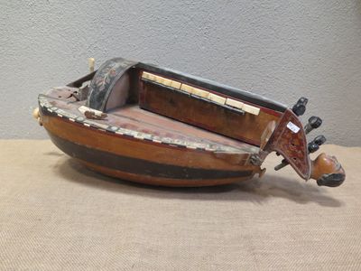 a small wooden boat that is sitting on a table