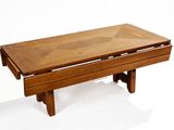 a wooden table with a glass top on a white background