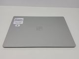 the surface of the surface of the surface is white and has a sticker on it