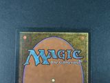 a close up of a magic the gathering card on a table