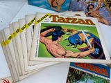 many comics on the table with a lot of them