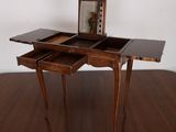 a wooden table with a mirror on top of it