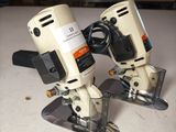 two electric tools that are sitting on a table