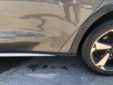 a close up of a car ' s tire on the street