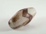 a white and brown object on a white surface