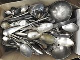 a box full of silver spoons and spoons in it