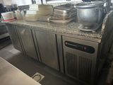a kitchen counter with a bunch of dishes on top of it