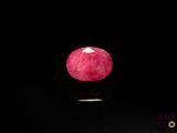 an image of a red apple on a black surface