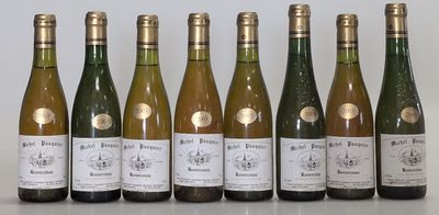 six bottles of wine are lined up in a row on a table