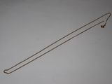 a long gold necklace with a long chain attached to it