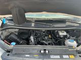 a car engine with its hood open on the street