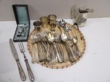a tray with silverware on it on a table