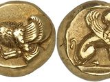 a gold coin with an image of a lion on it