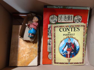 une boîte contenant une poupée et un livre