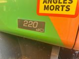 an image of a green and orange truck with a sticker on it