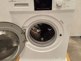 a washing machine that is sitting on a pallet