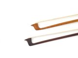 two pieces of wood are shown on a white surface