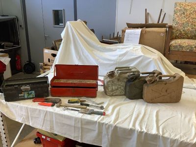a table with many items on it in a room