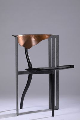 a close up of a chair with a wooden seat and a metal frame