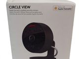 the box of the apple homekit camera is open on a white surface
