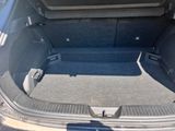 a trunk of a car with the back seats folded down