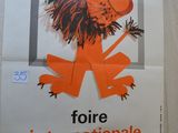 poster of a lion with a cigarette in its mouth on a wall