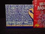 two boxes of cereal sitting next to each other on a table