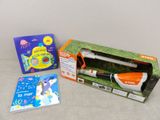 a box with a pen, a book, and a picture of a penguin
