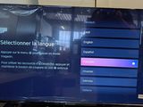 a flat screen tv sitting on a table in a room