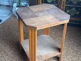 a small wooden table with a shelf on top of it