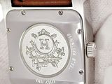 a close up of a wrist watch with a leather band