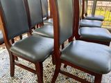 six chairs sitting in a row on a tiled floor
