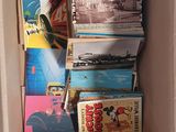 a cardboard box filled with books on the floor