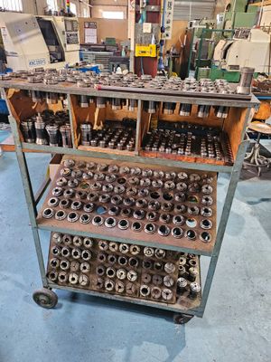 many different types of tools on a cart in the shop