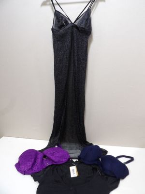 purple and black lingersuits on a hanger next to a black bra top