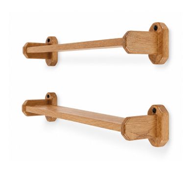 a pair of wooden hooks on a white wall