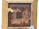 a picture of a piece of wood with a tag on it