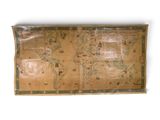 an old map of the world is displayed on a wall