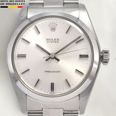 a watch that is sitting on a white surface