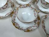 a lot of plates and cups sitting on a table