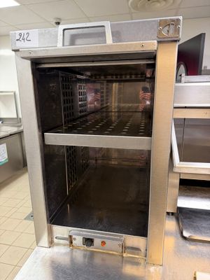 an oven that is sitting in the middle of a kitchen
