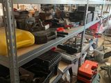 a lot of tools on the shelves in the room
