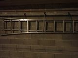 a picture of a ladder hanging on a wall